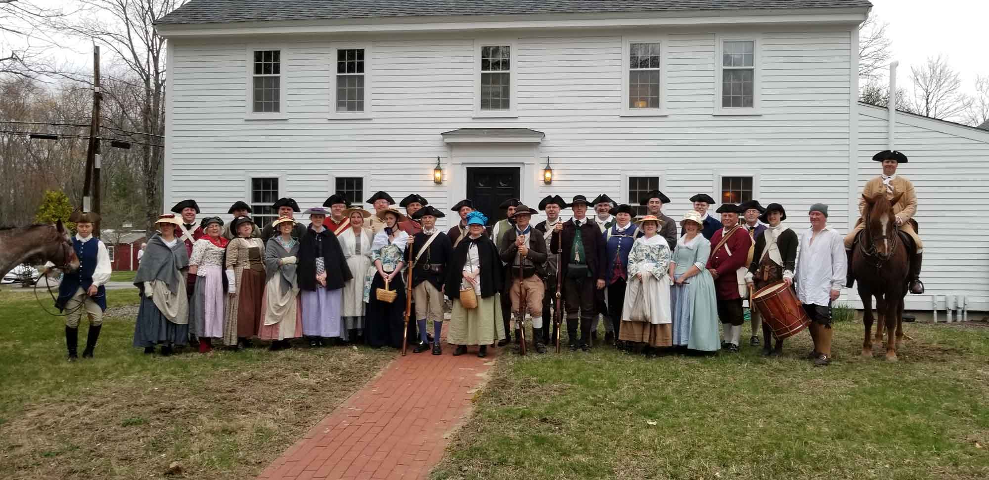 The-men-and-women-of-the-Acton-Minutemen-reenactor-unit-in-2019.-Photo-by-the-Acton-Minutemen..jpg